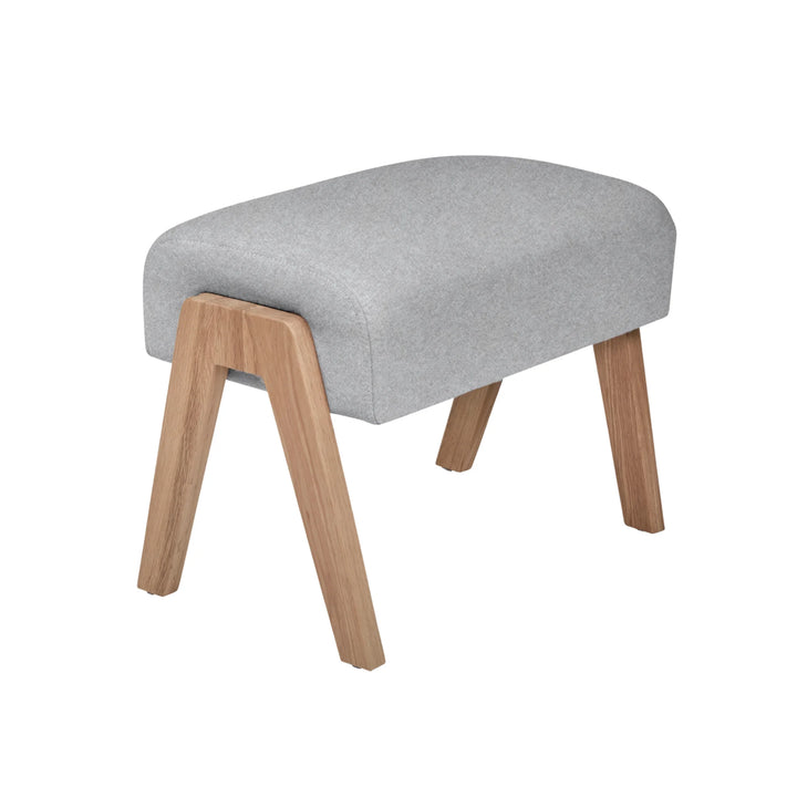 Hera Footstool in dusk with oak legs on white background.