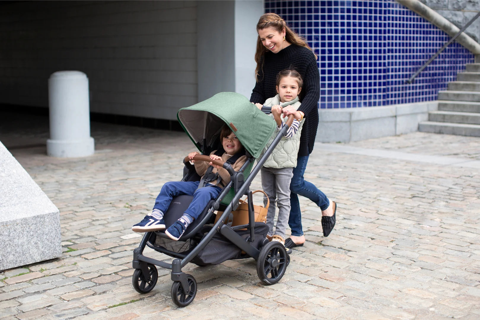 UPPAbaby Cruz V2 All Wheel Patented Suspension System feature in Gwen Fashion with piggyback ride along board