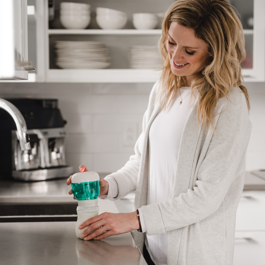 BBLuv Uvi portable steraliser being used to steralise the nipple top of a bottle