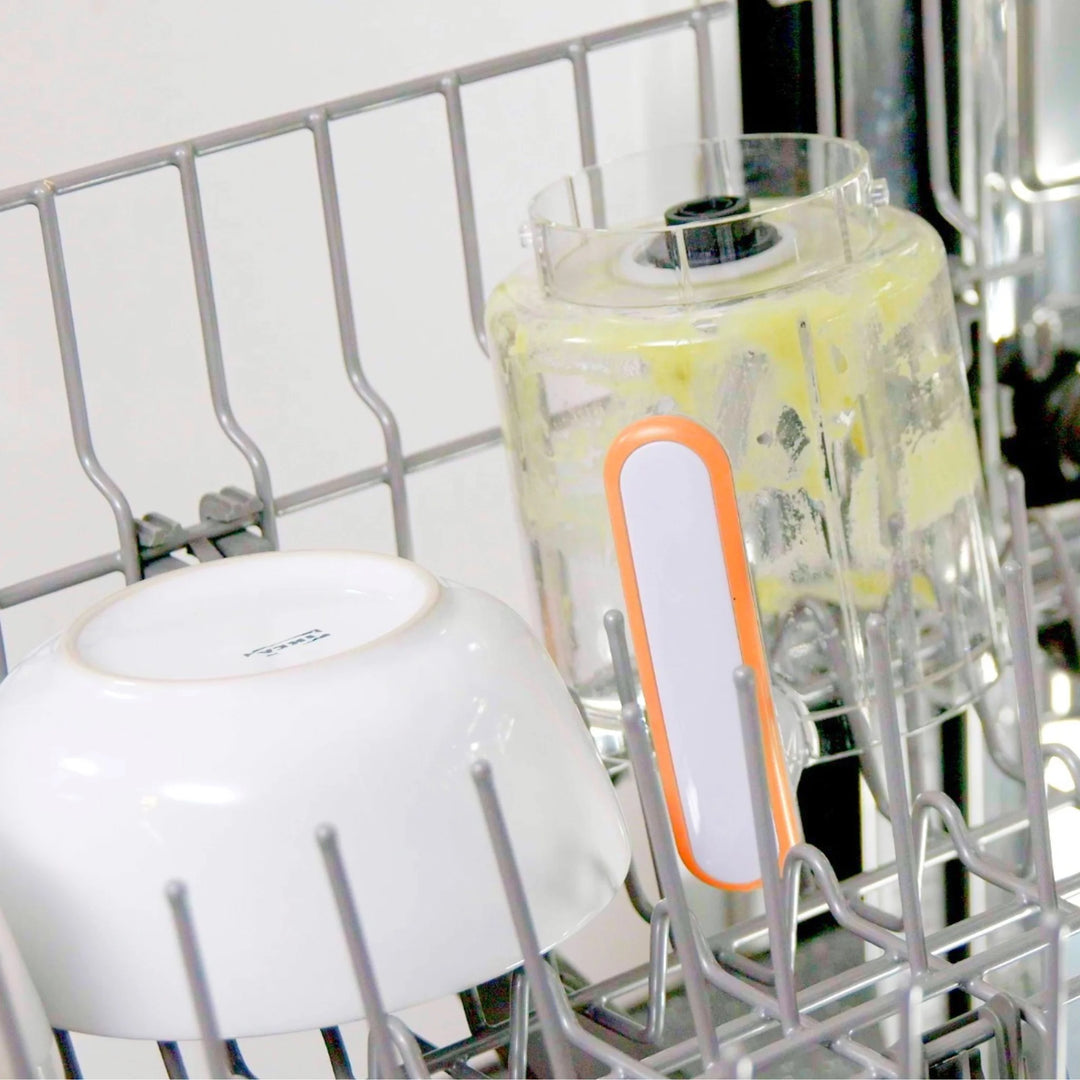 Quook by Quark 5-in-1 baby food maker jug in dishwasher — easy-clean detachable blending bowl with orange handle, dishwasher-safe design for convenient baby food preparation and hassle-free cleaning.