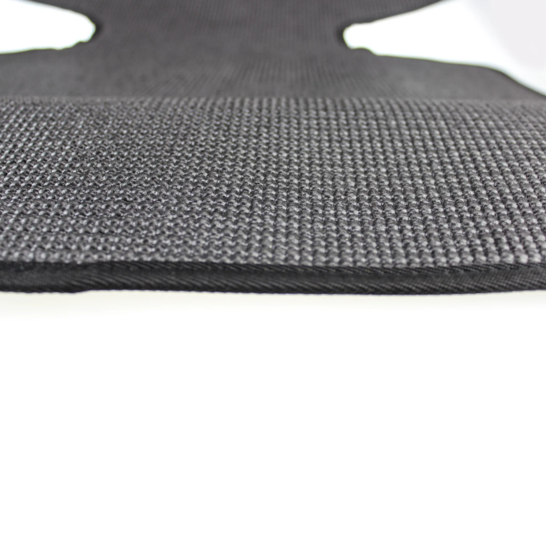 Close-up of black textured seat protector.
