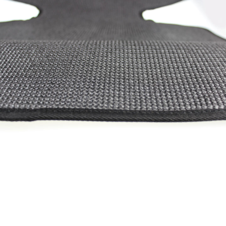 Close-up of black textured seat protector.