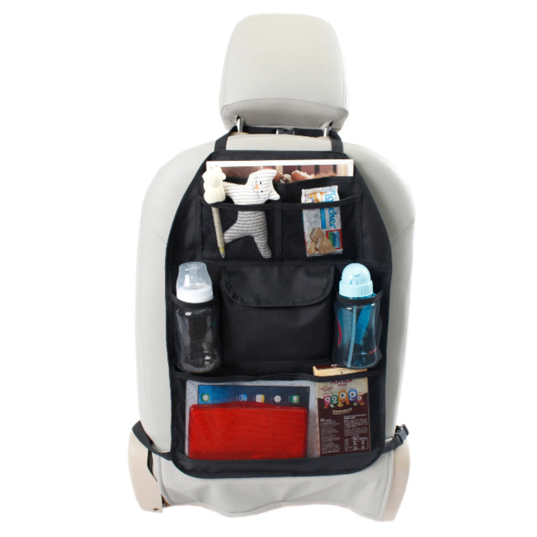 EziMoov EZI Travel Plus car seat back organiser installed on a grey front seat, shown fully loaded with children’s travel essentials including toys, books, snacks, a baby bottle, and a water bottle. Features multiple mesh pockets and a spacious central compartment designed to keep kids’ items organised and easily accessible during family road trips.