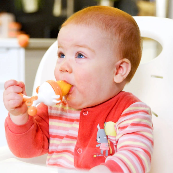 Baby using Fruuti by Quark silicone fruit feeder – BPA-free teething feeder for introducing solids, soothing gums, and promoting safe self-feeding