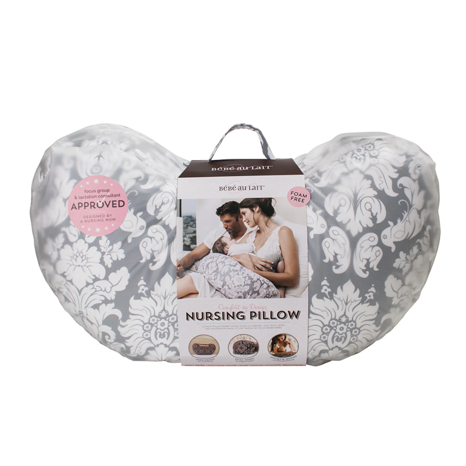 Bebe au Lait Complete Nursing Pillow in Chateau Silver design, shown in packaging with grey and white damask print, foam-free fill, lactation consultant approved badge, and imagery of parents using the ergonomic breastfeeding support pillow.