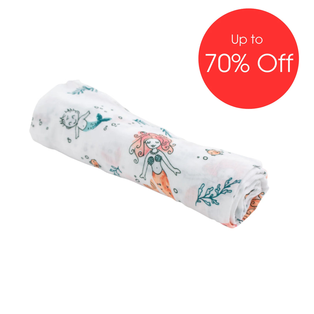 Bebe Au Lait muslin baby blanket in Mermaid print featuring whimsical mermaid and ocean-themed illustrations, soft breathable cotton swaddle blanket displayed rolled with ‘Up to 70% Off’ sale badge.