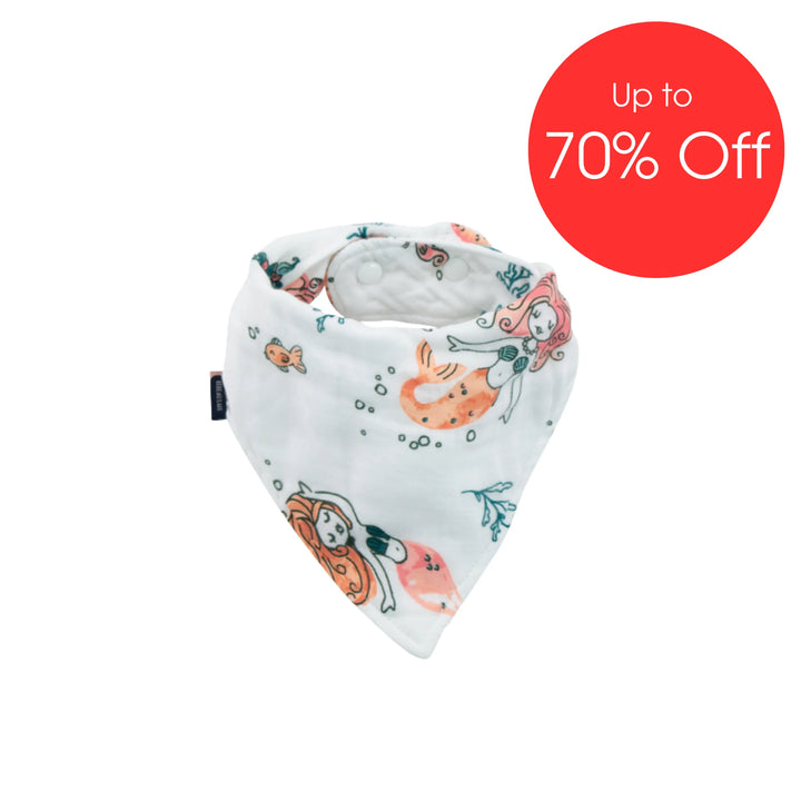 Bebe Au Lait muslin bandana bib in Mermaid print featuring cute mermaid and ocean-themed illustrations, soft absorbent baby dribble bib with snap closure displayed with ‘Up to 70% Off’ sale badge.
