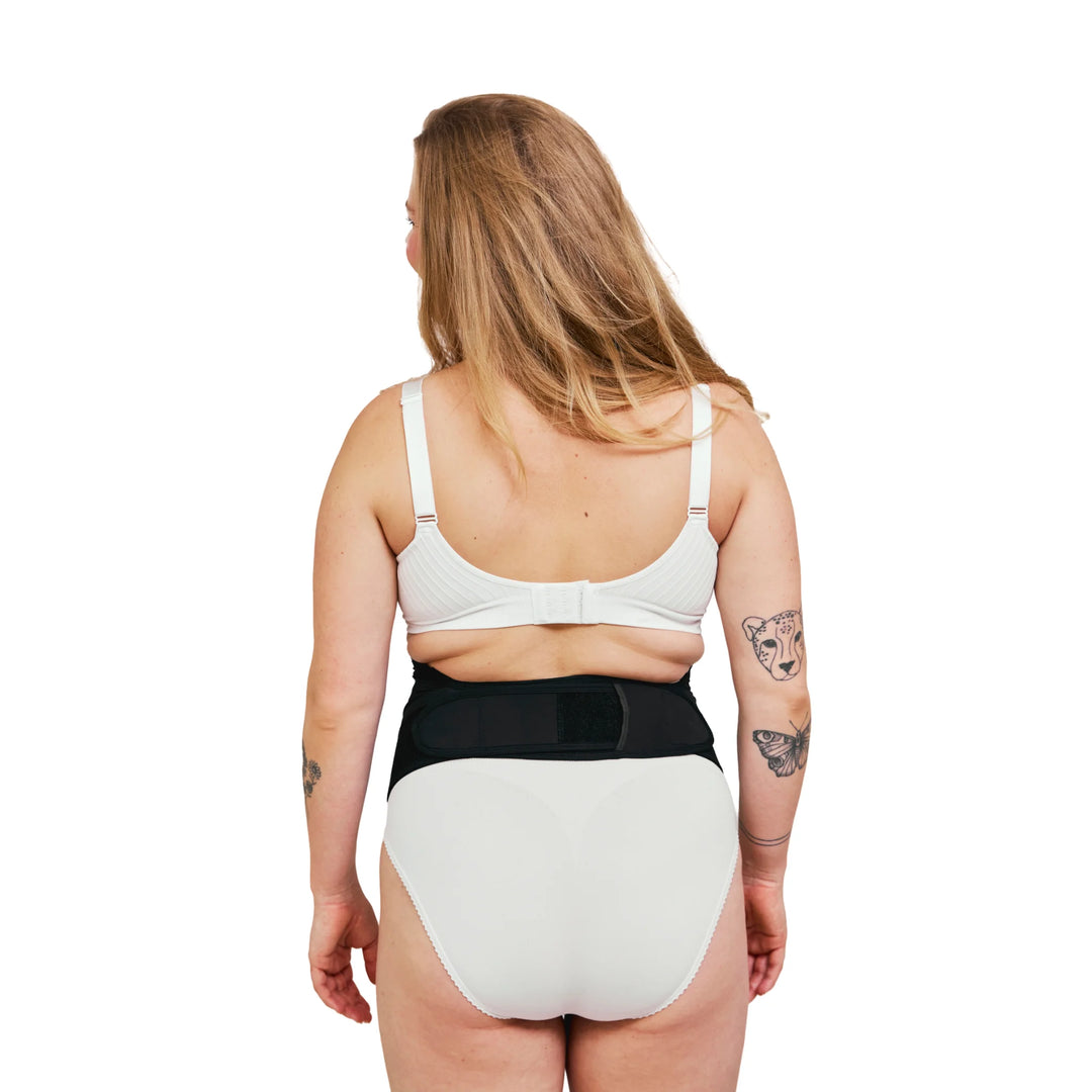 Back view of Carriwell adjustable maternity support belt in black, showing secure rear fastening and supportive under-bump pregnancy design for back, pelvic and abdominal support.