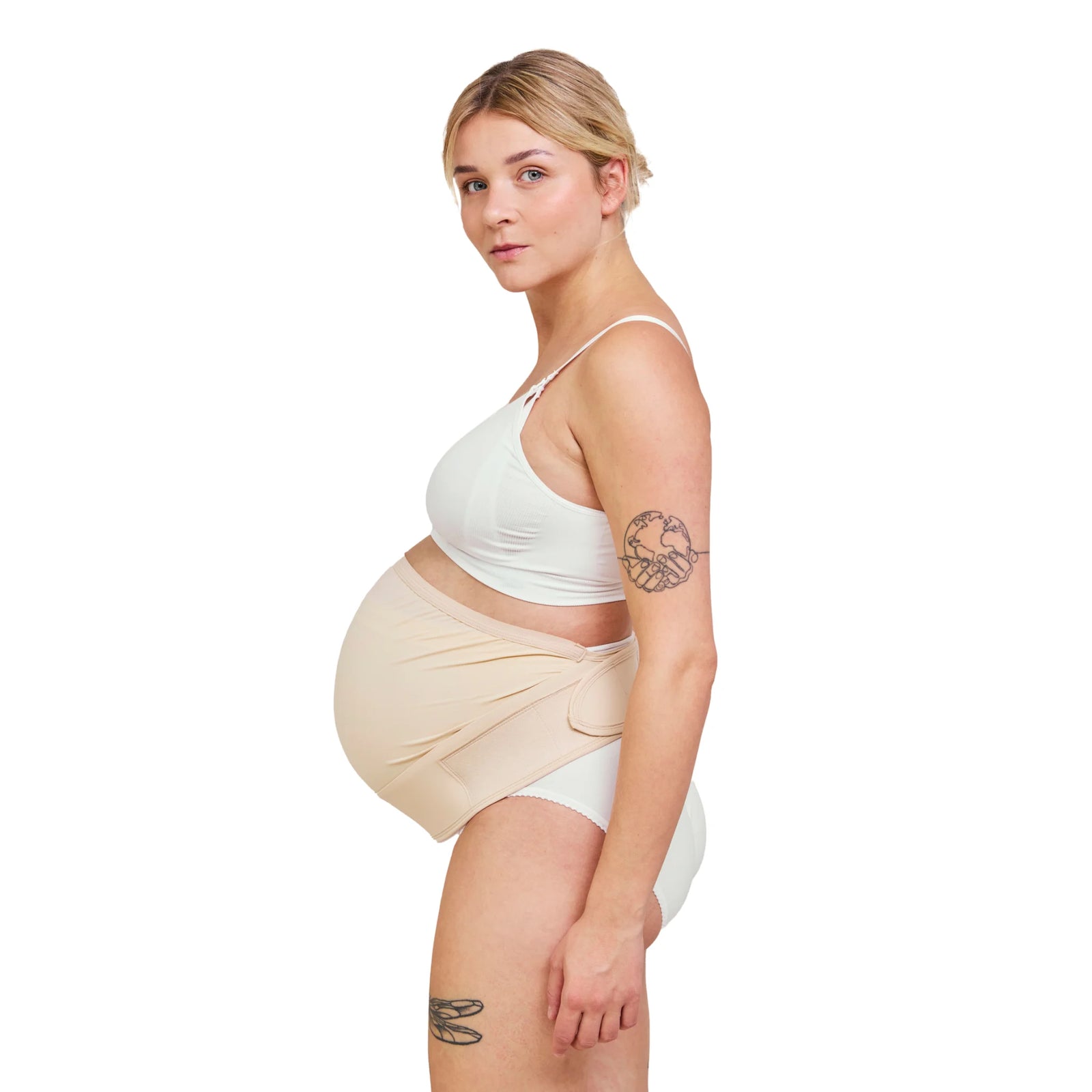Side view of pregnant woman wearing Carriwell adjustable maternity support belt in honey colour, showing supportive over-bump design that helps relieve lower back, pelvic, and abdominal pressure during pregnancy.