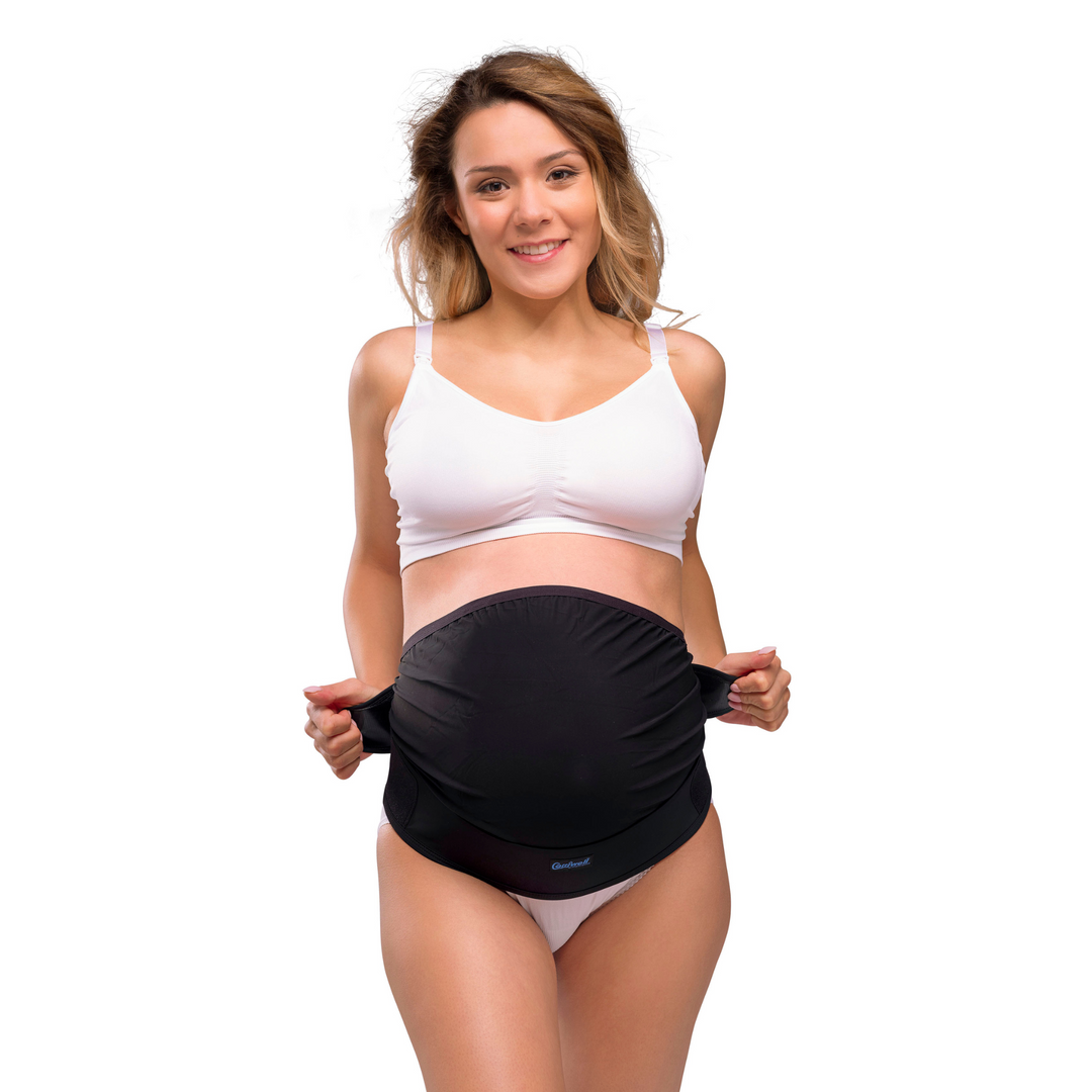 This is a product shot of the black Carriwell adjustable support belt on a pregnant model.