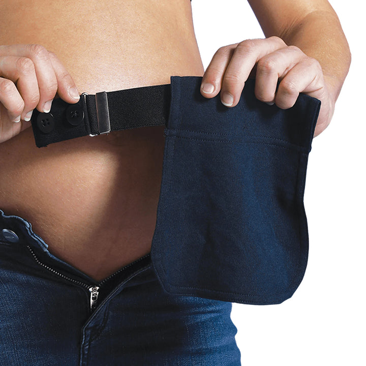 Person holding navy fabric of flexibelt on elastic strap.