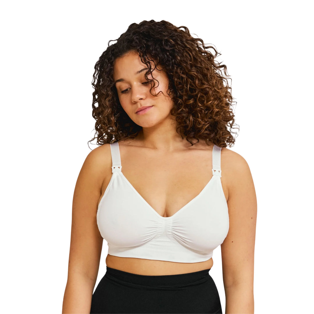 Woman wearing gel-support breastfeeding bra from Carriwell on a white background.