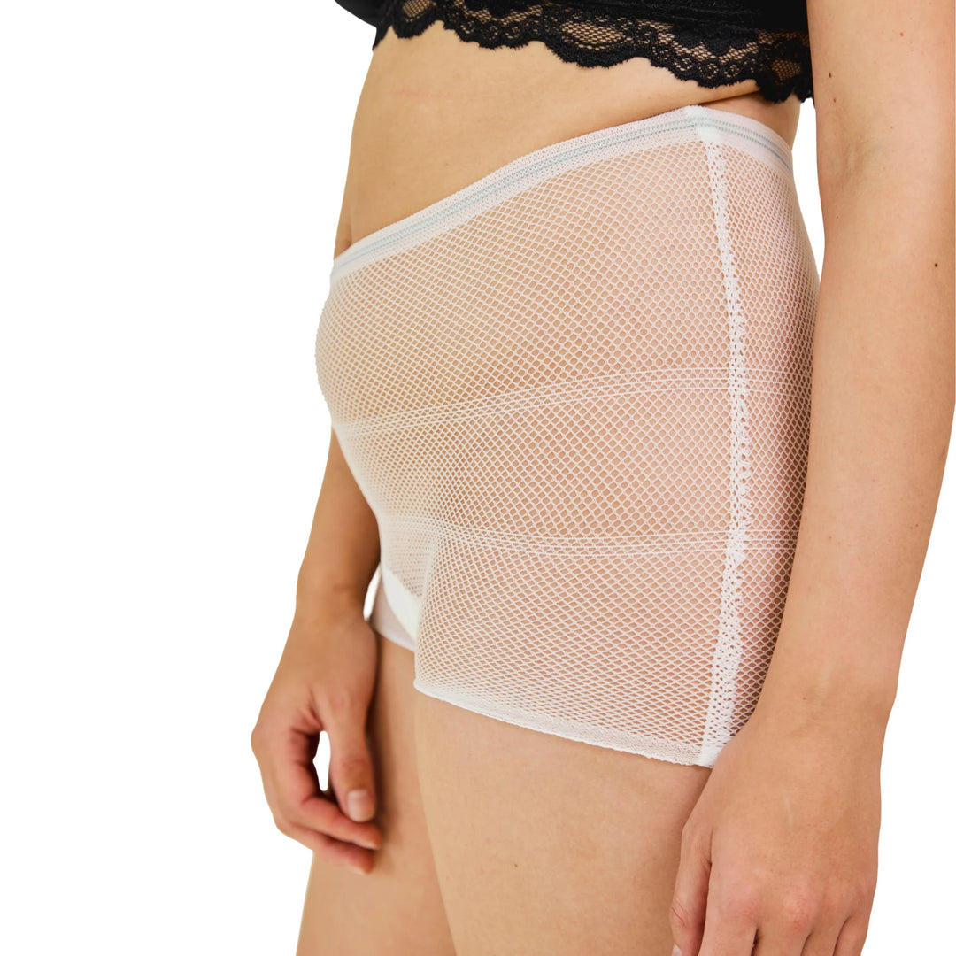 Angled side view of Carriwell hospital pants showing breathable white mesh maternity underwear designed to hold maternity pads securely for post-birth and postnatal recovery.