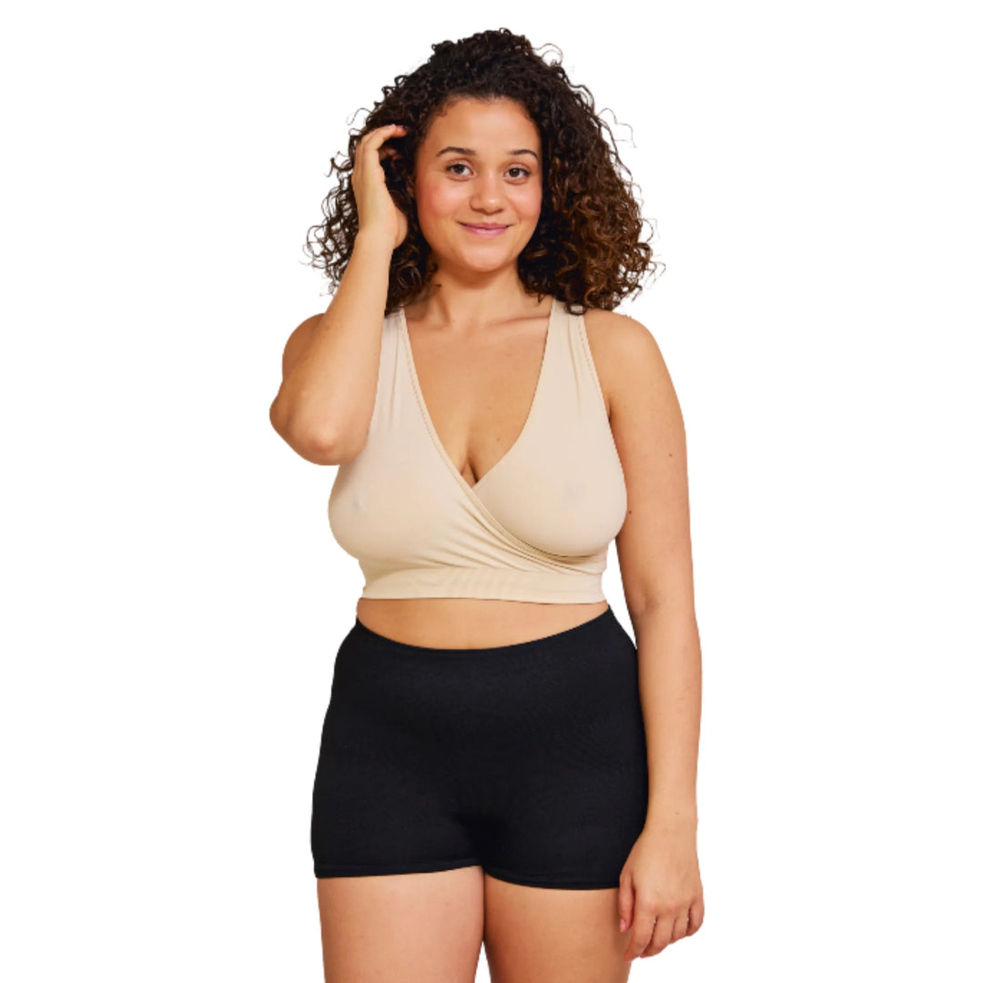 Front view of a woman wearing Carriwell maternity hospital pants in black, featuring a seamless, soft and breathable design for comfort during labour, hospital stays and postnatal recovery, paired with a nursing bra.