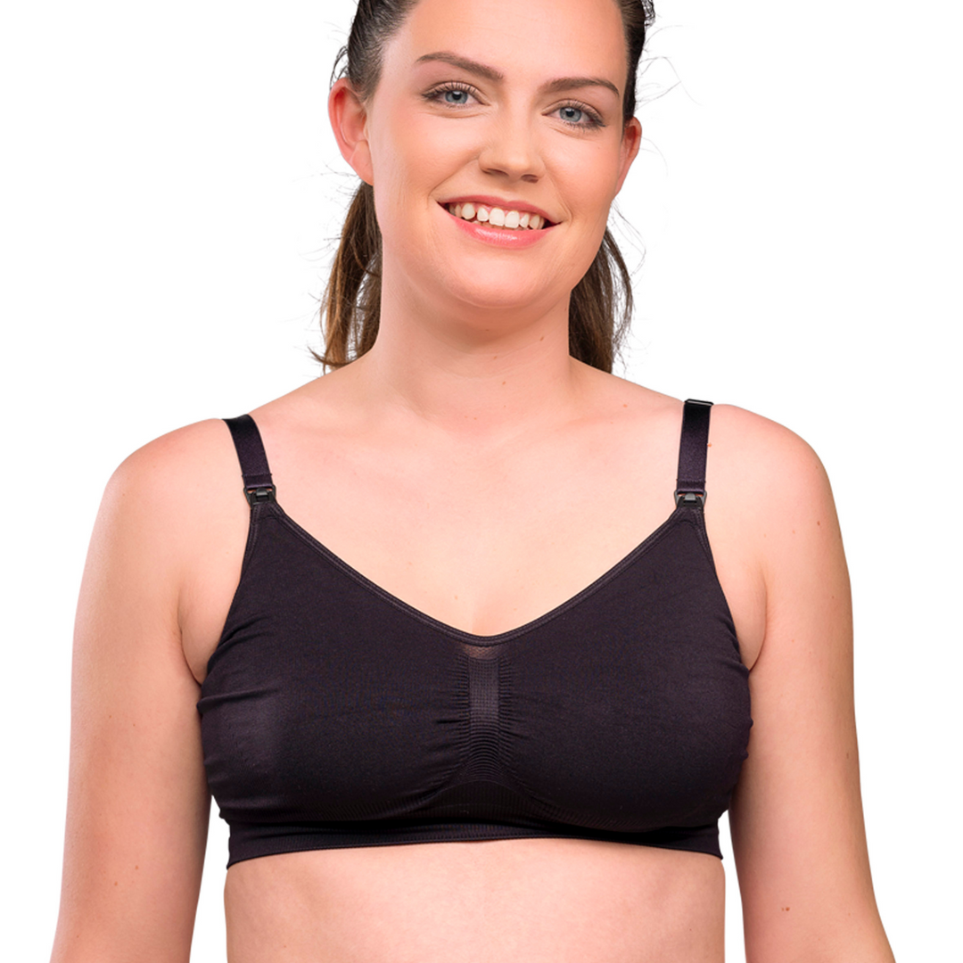 This image shows the black bra on a smiling model.