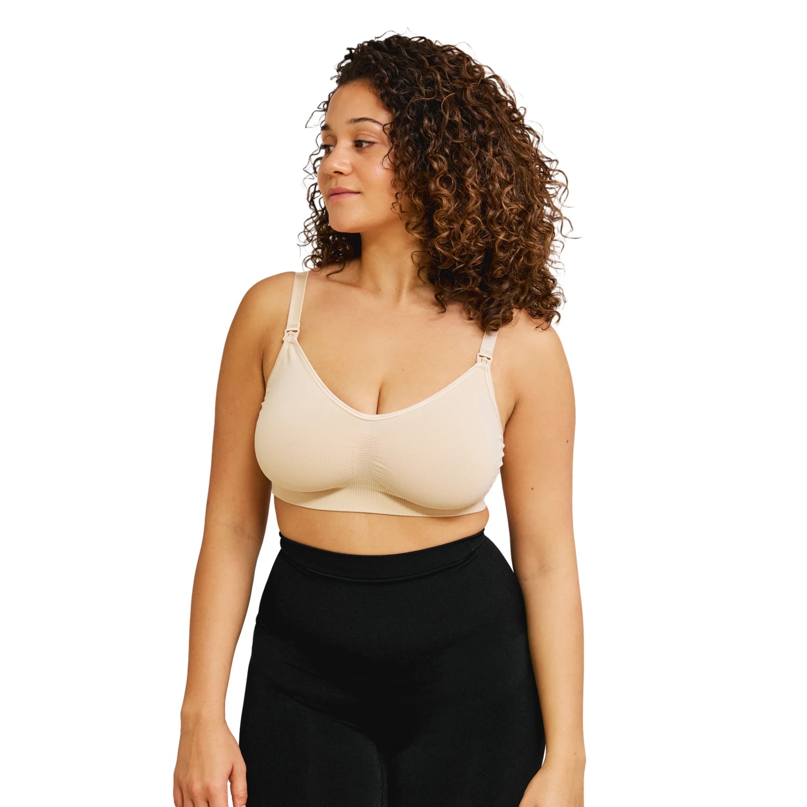 “Model wearing Carriwell maternity & nursing bra in Honey (beige) on white background.”