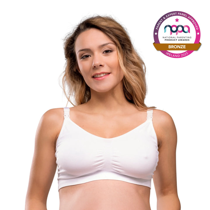 Pregnant mother wearing ClevaMama Maternity and Nursing Bra in white – award-winning seamless breastfeeding bra with clip-down cups, soft stretch fabric for comfort and support, Bronze winner at National Parenting Product Awards 2025 Ireland