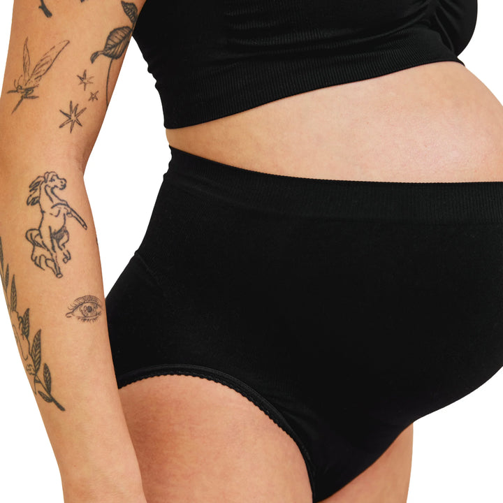 Close-up of black Carriwell maternity support panty showing soft stretch fabric and over-bump design for gentle belly support during pregnancy.