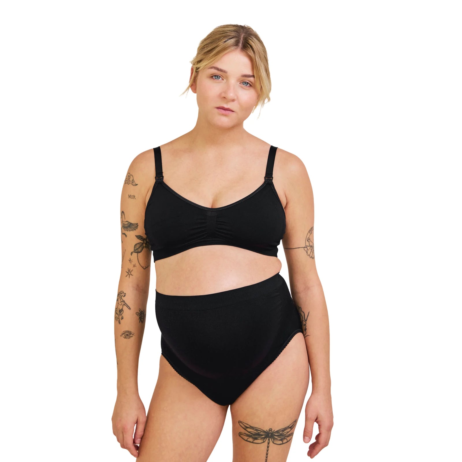 Front view of pregnant woman wearing black Carriwell maternity support panty, designed to support the growing belly and provide comfortable everyday wear during pregnancy.