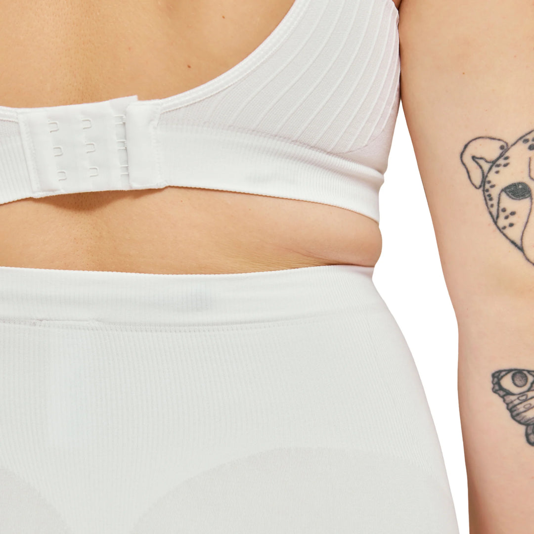 Close-up of white Carriwell maternity support panty showing soft stretch fabric and over-bump design for gentle belly support during pregnancy.