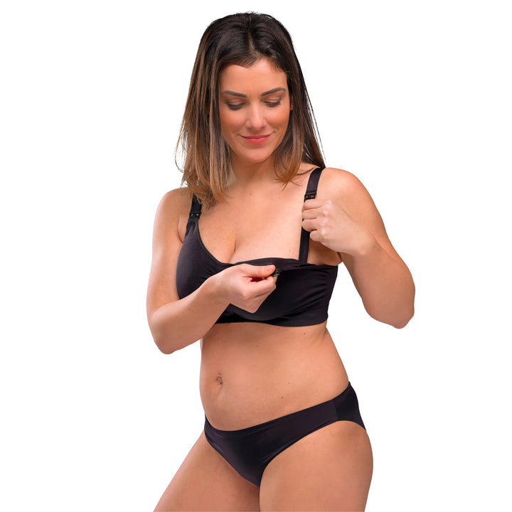 Woman using clasp dropdown cups on Carriwell padded maternity and nursing bra.