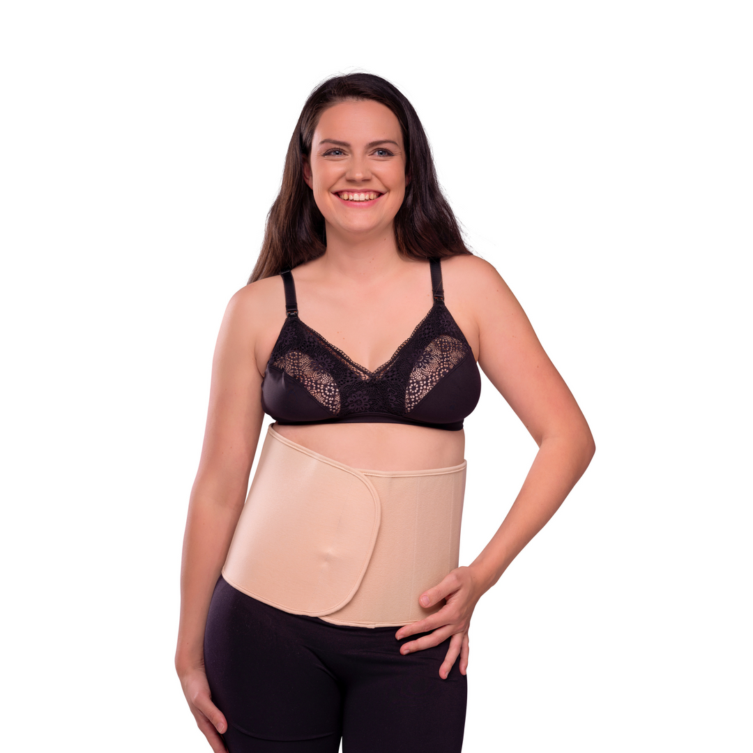 This image shows the belly binder in natural on a smiling model.