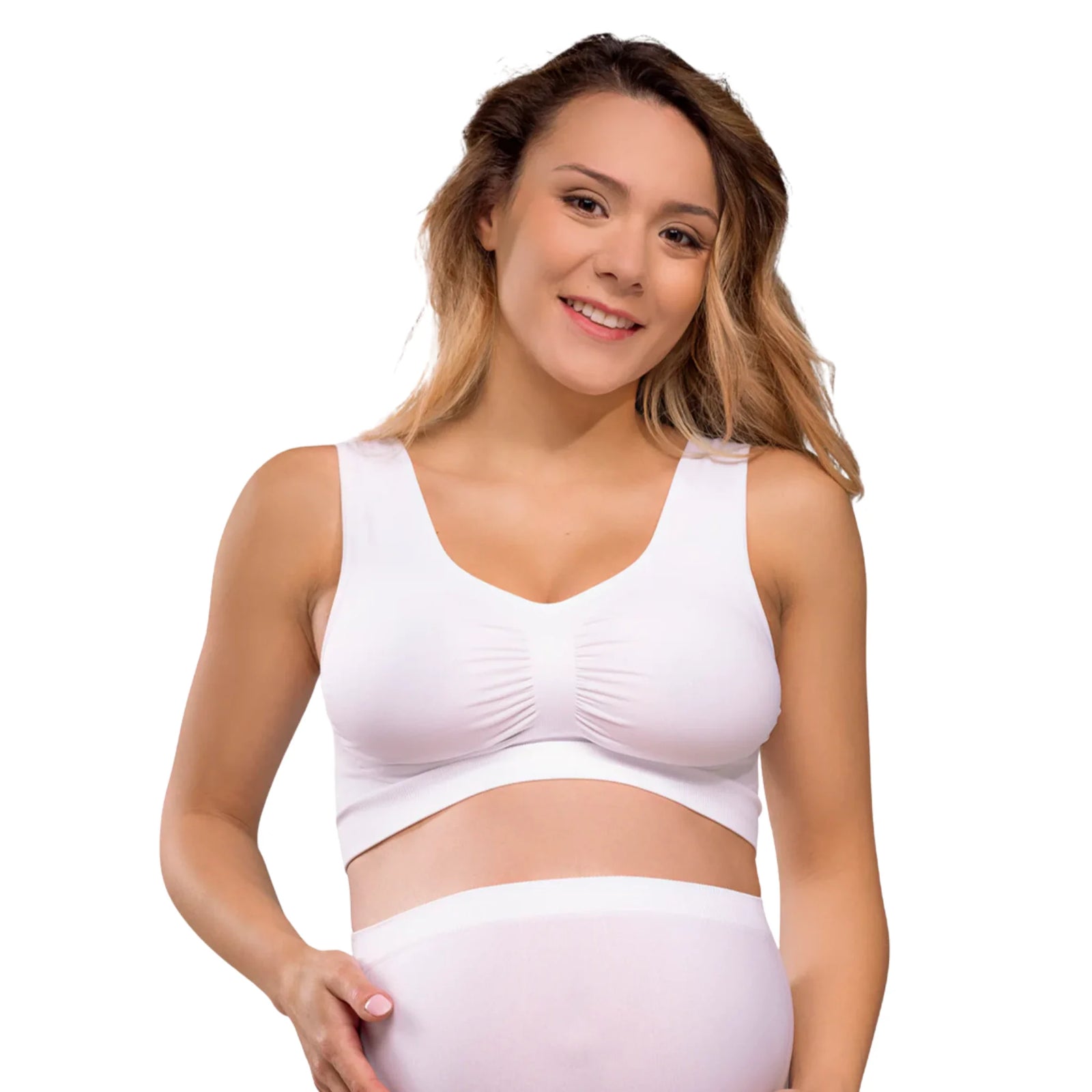 Woman wearing a white Carriwell seamless maternity bra, providing soft stretch support and everyday comfort throughout pregnancy.
