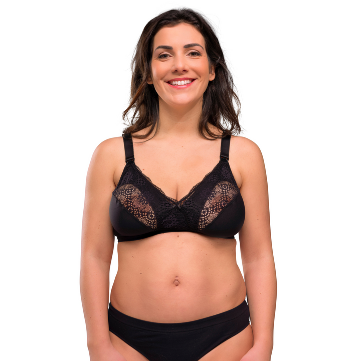 This image shows the silk nursing bra in black on a smiling mum.