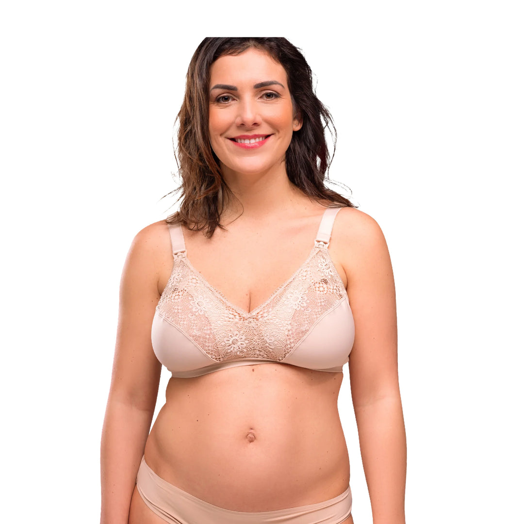 Front view of a model wearing the beige Carriwell Soft As Silk nursing bra, featuring soft lace cups, wire-free support and discreet one-hand nursing clips for comfortable breastfeeding.