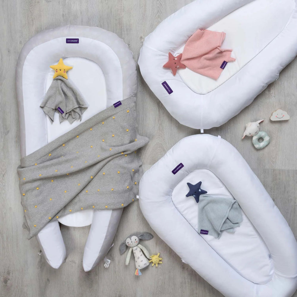 ClevaMama ClevaFoam Baby Pods with soft blankets and toys — premium breathable baby nests for safe sleep, tummy time, and lounging, featuring ClevaFoam technology for comfort and support, ideal for newborns and infants.