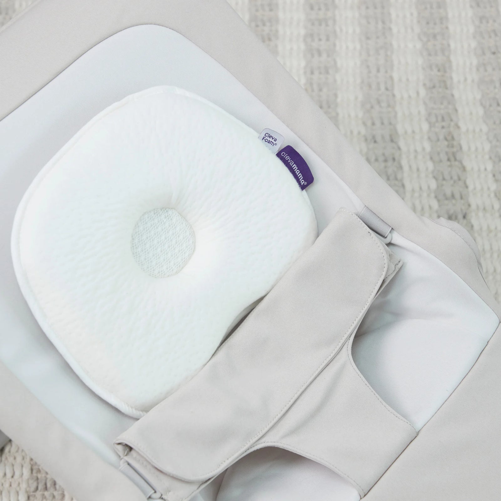 ClevaMama ClevaFoam Baby Head Pillow in infant bouncer – breathable memory foam newborn pillow for flat head prevention, providing ergonomic neck and head support for babies.