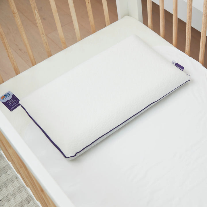 Clevamama Waterproof Support Mattress shown with ClevaFoam toddler pillow in a cot – hypoallergenic, breathable, and waterproof baby mattress designed for comfort, safety, and spinal support, ideal for newborns and toddlers.