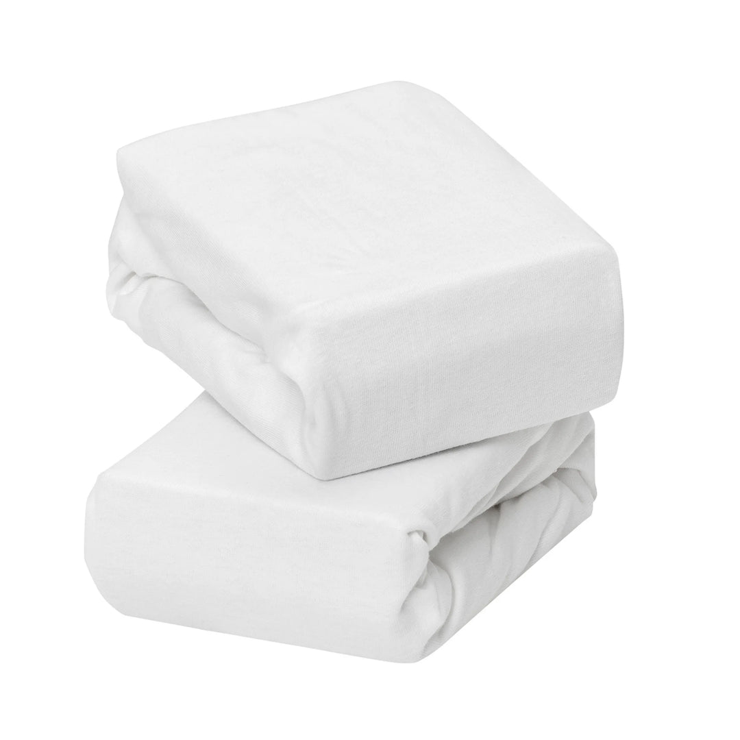 White jersey cotton fitted sheets for cot and cot bed, twin pack, shown neatly folded to highlight soft breathable fabric and premium quality nursery bedding.