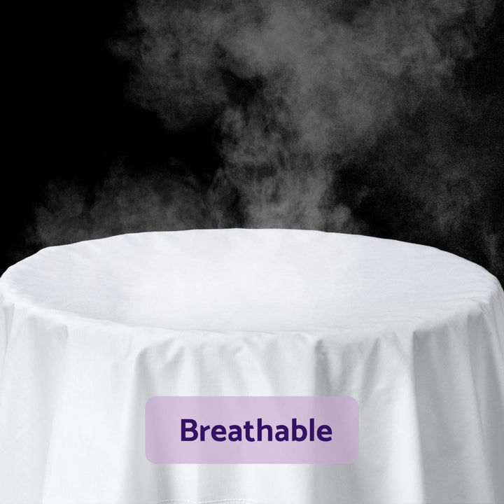 ClevaMama Tencel Fitted Waterproof Mattress Protector breathable feature — demonstrates airflow through the soft Tencel fabric. Shows steam passing through white fabric layer, highlighting breathable, temperature-regulating, and moisture-wicking properties for baby comfort. Premium waterproof and hypoallergenic cot mattress protector.