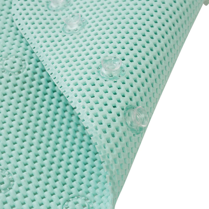 Close-up of the ClevaMama XL bath mat and kneeling cushion texture with suction cups on a white background