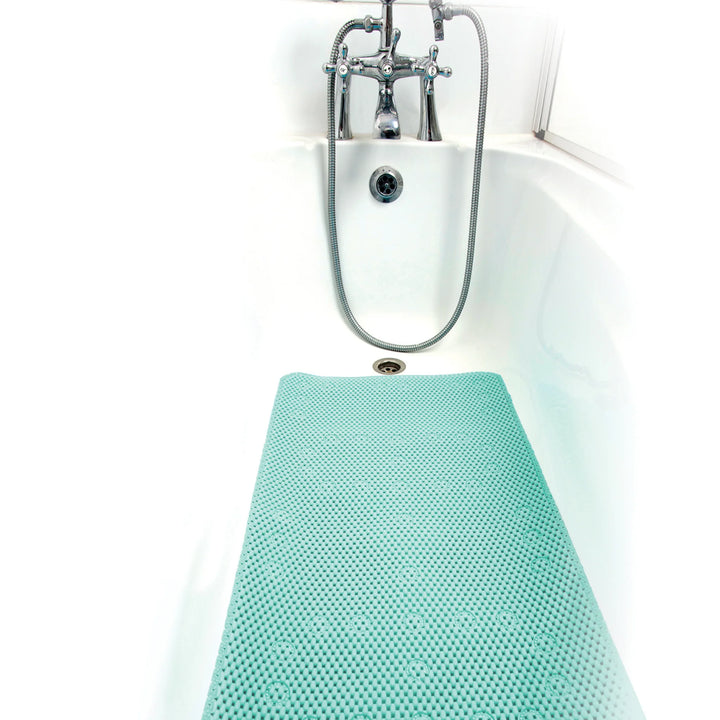 ClevaMama XL bath mat placed in a white bathtub beneath the shower tap