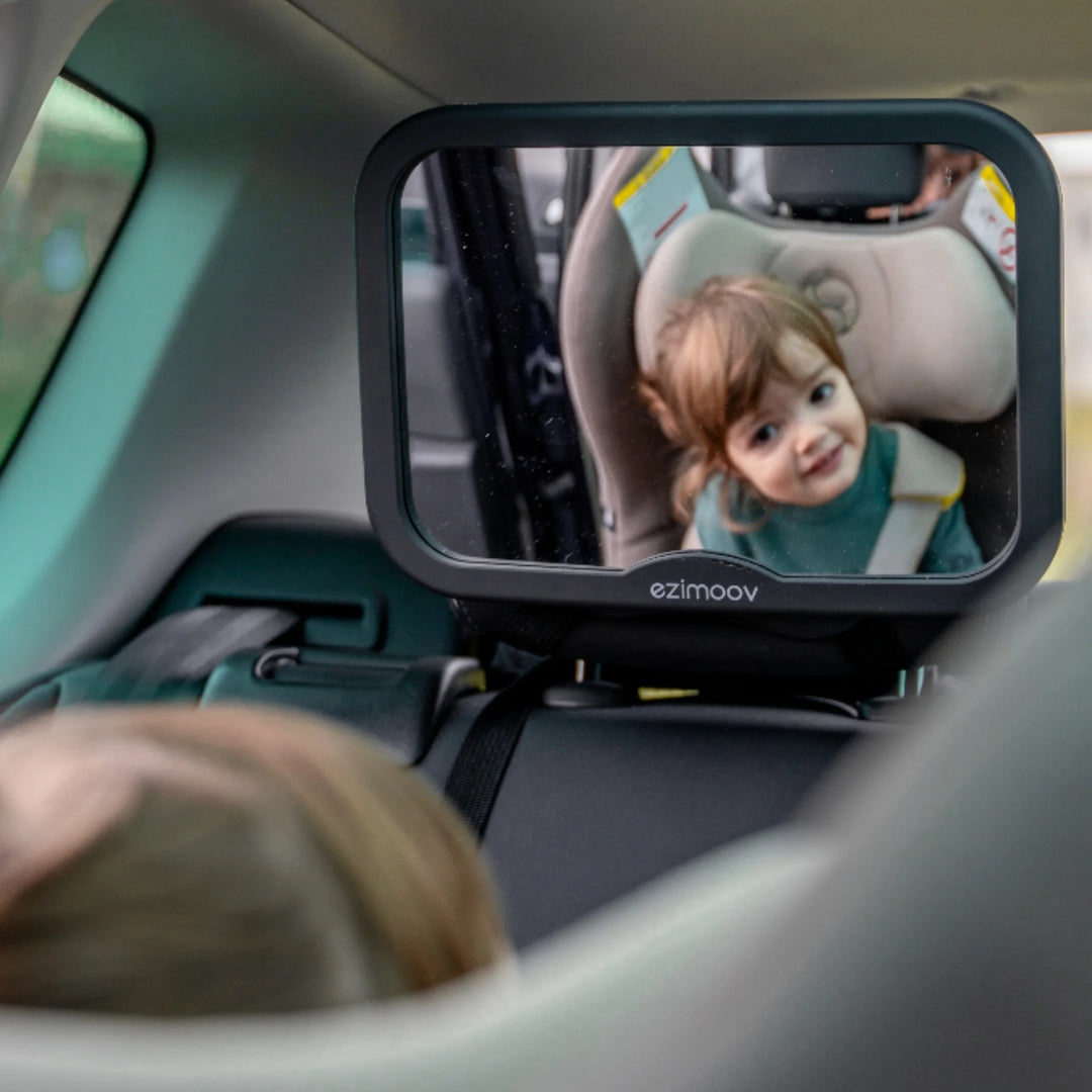 Ezimoov adjustable square back seat car mirror installed on headrest, reflecting baby in rear-facing car seat