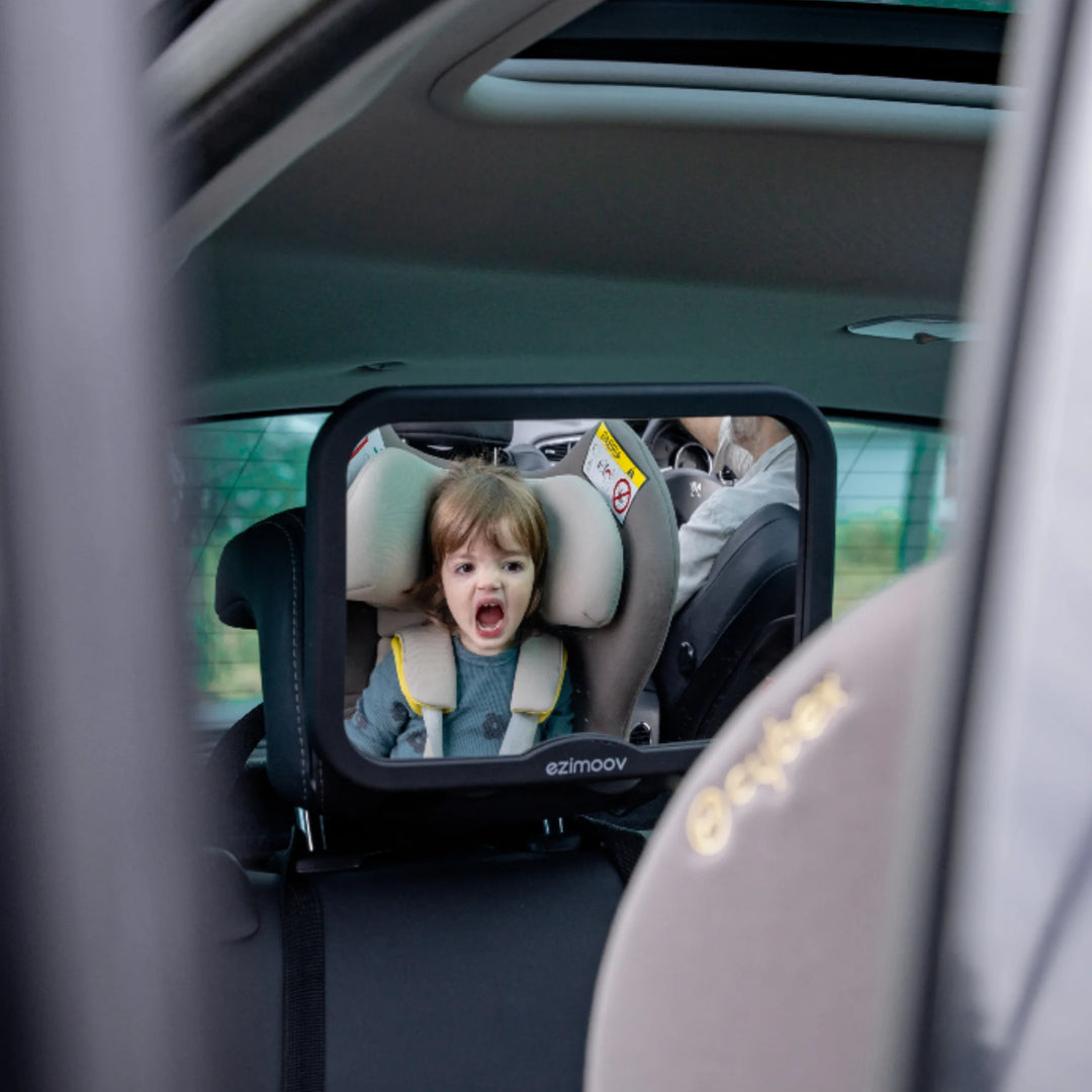 Ezimoov adjustable square back seat car mirror reflecting toddler in rear-facing car seat