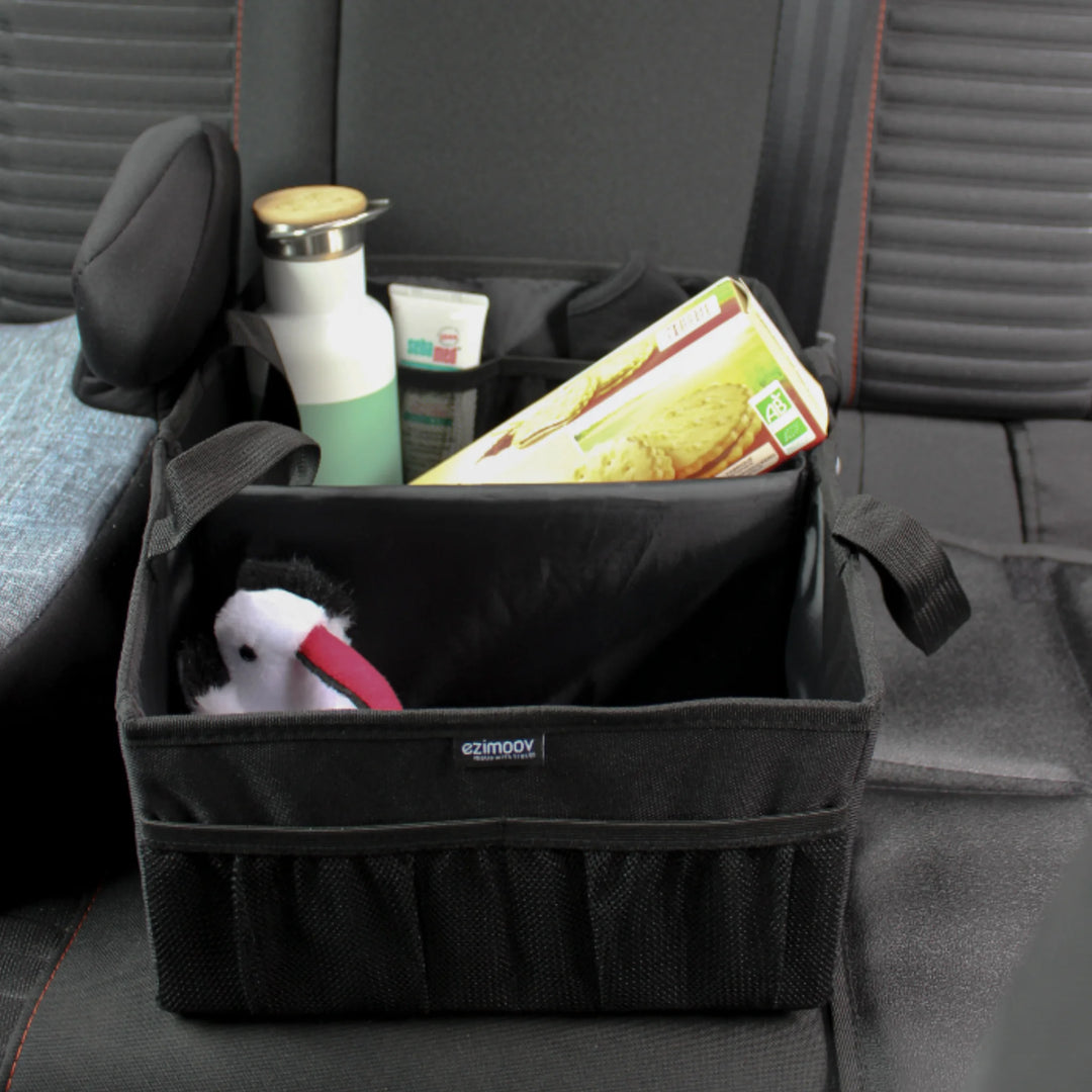 Ezimoov car storage and organiser with compartments holding snacks, bottle and essentials in back seat