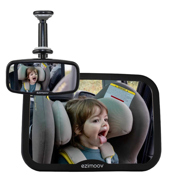 EziMoov clip-on rear-view baby mirror pack showing a toddler in a rear-facing car seat making a funny face, displayed in both the large backseat mirror and the smaller clip-on mirror.