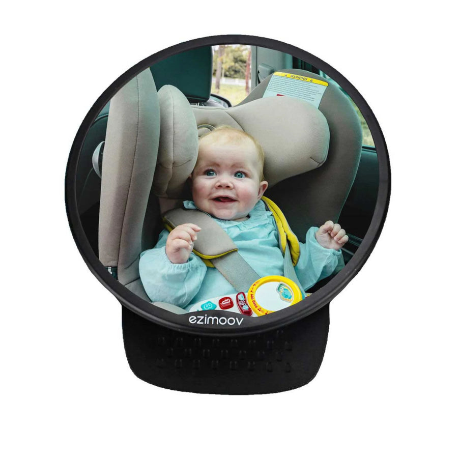 This image shows the Ezimoov Round Mirror with a smiling baby in the reflection.