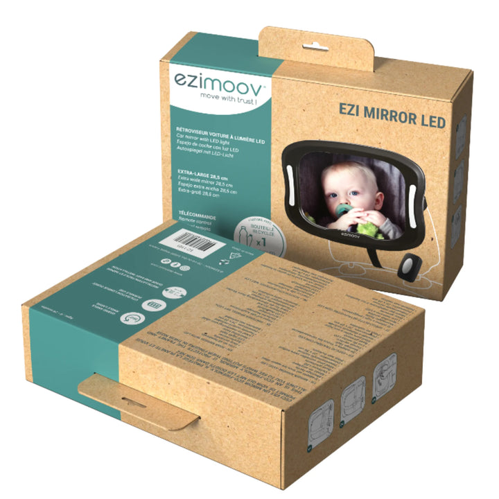 EziMoov EZI Mirror LED baby car seat mirror packaging, showing eco-friendly box design with product features, wide-angle LED-illuminated safety mirror, and image of a rear-facing baby reflected in the mirror.