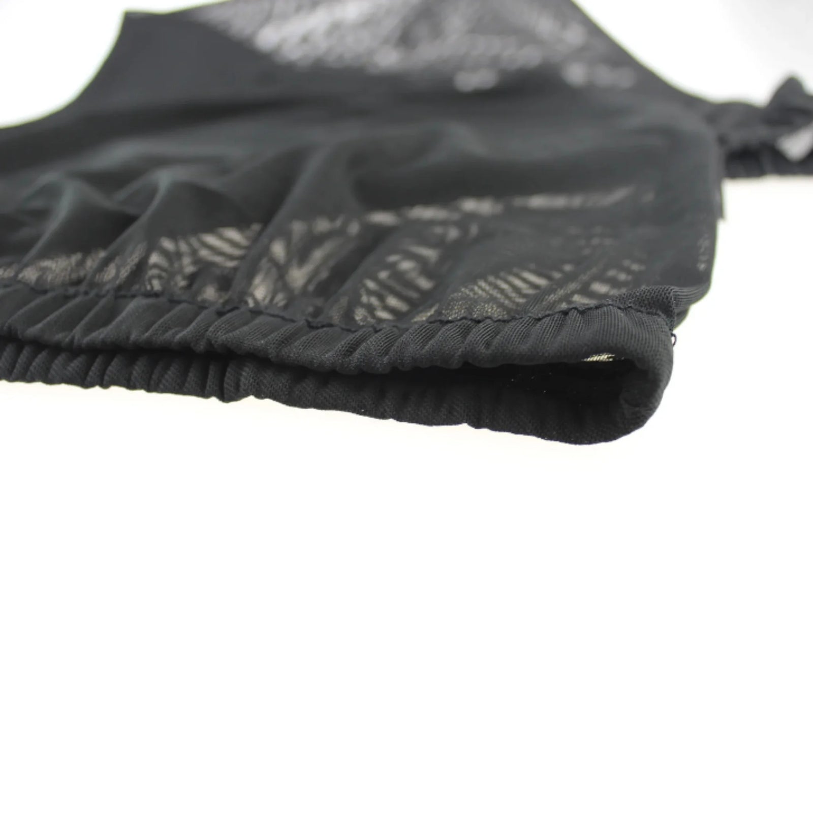 Close-up of the elastic edge on the EziMoov car window sun sock shade, showing the stretch-fit mesh fabric and reinforced stitching designed for secure fit, UV protection, and breathable coverage on vehicle windows.