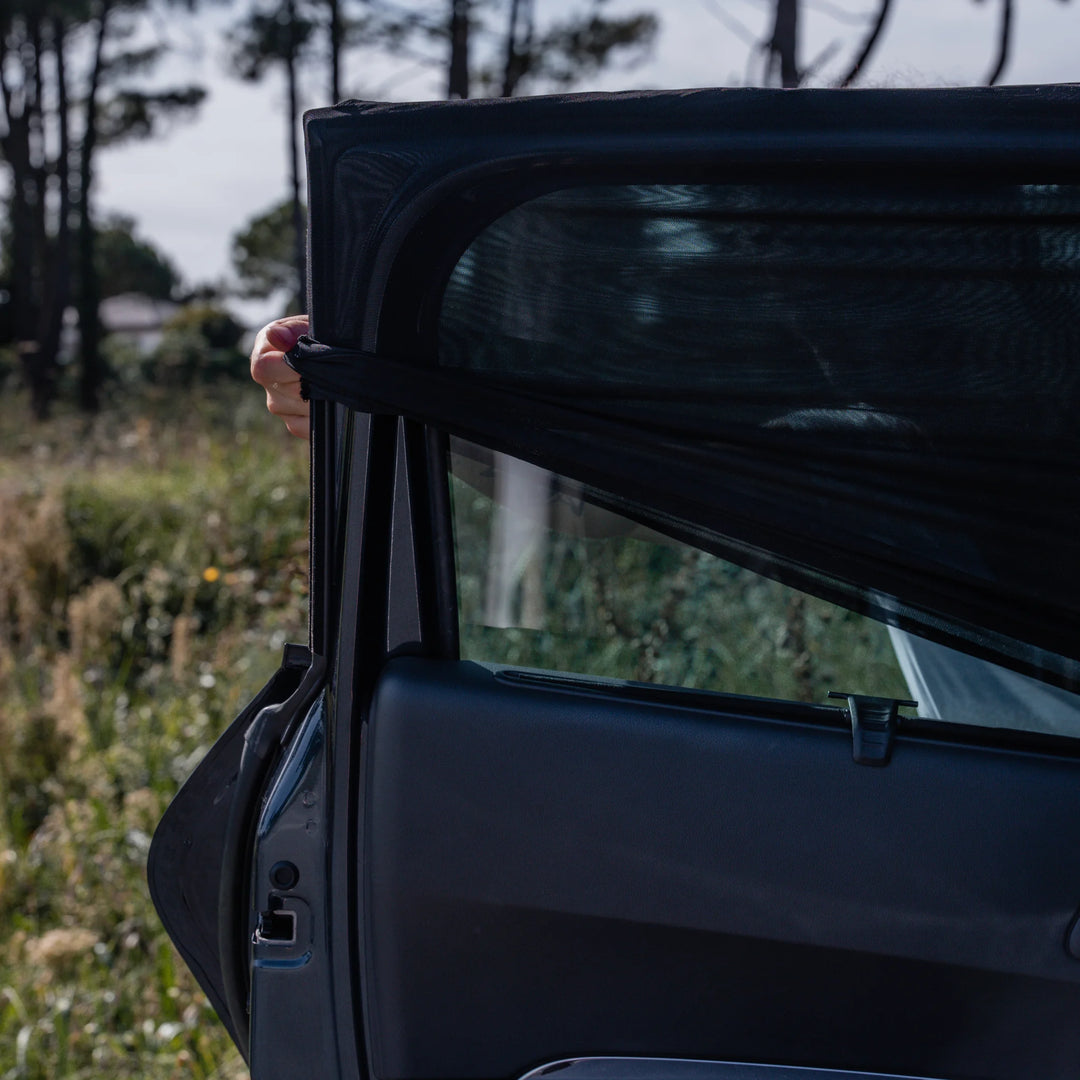 This image shows the Ezimoov Sun Socks being installed on the car window