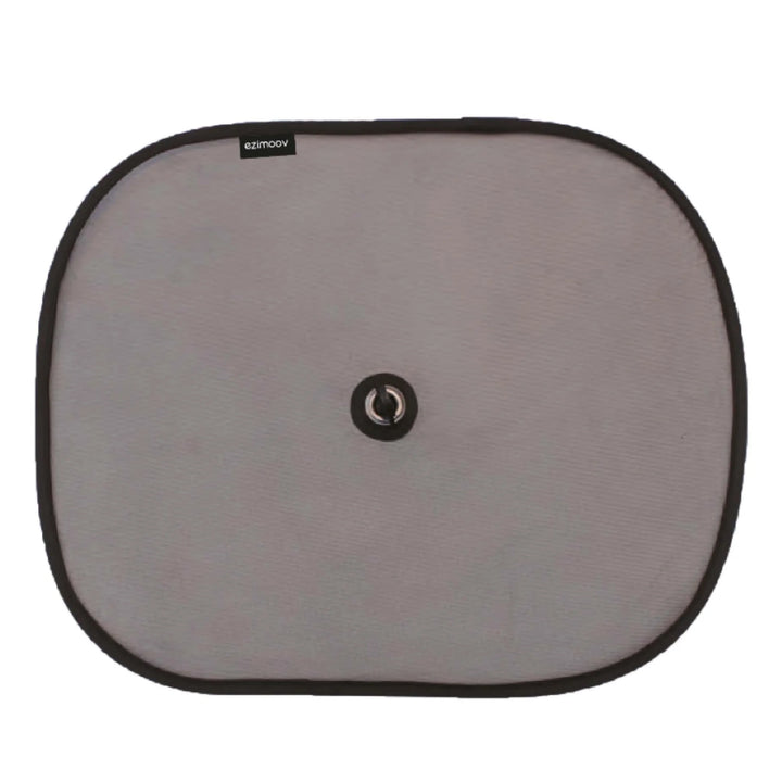 EziMoov car sun shade screen with central suction cup, lightweight foldable sun blocker designed to protect babies and children from UV rays in the car.