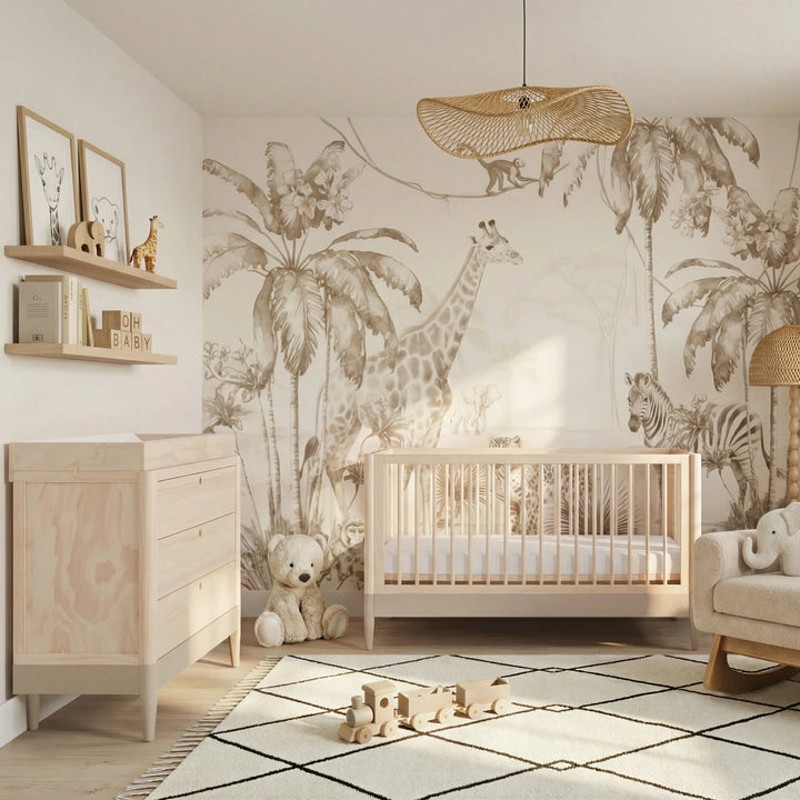 Gaia Baby Eos convertible cot in natural wood styled in a cashmere nursery with safari animal wall mural, dresser, shelves and soft neutral decor.