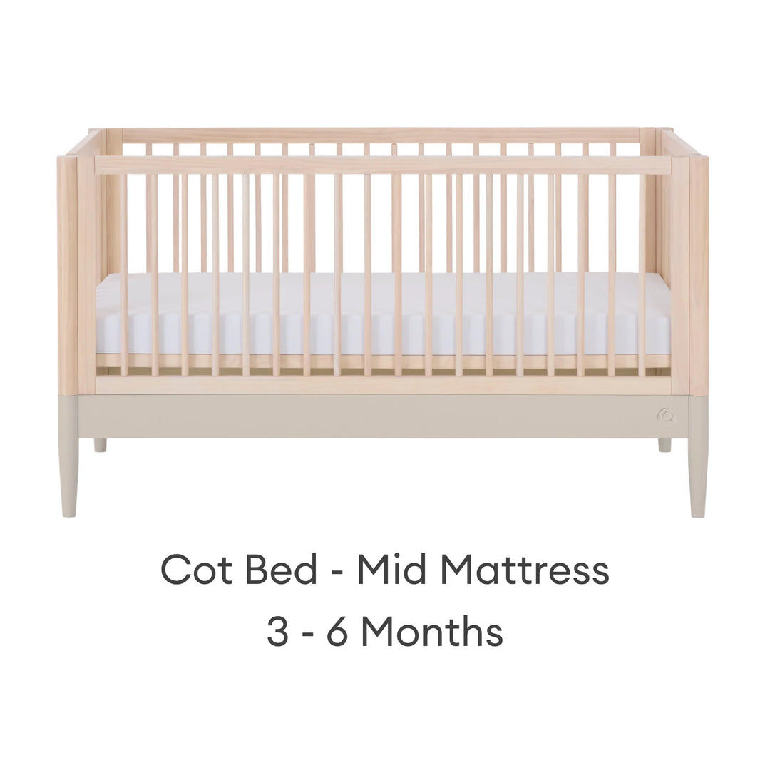 Gaia Baby Eos convertible cot bed in natural wood and cashmere finish with mid-height mattress setting for babies 3–6 months
