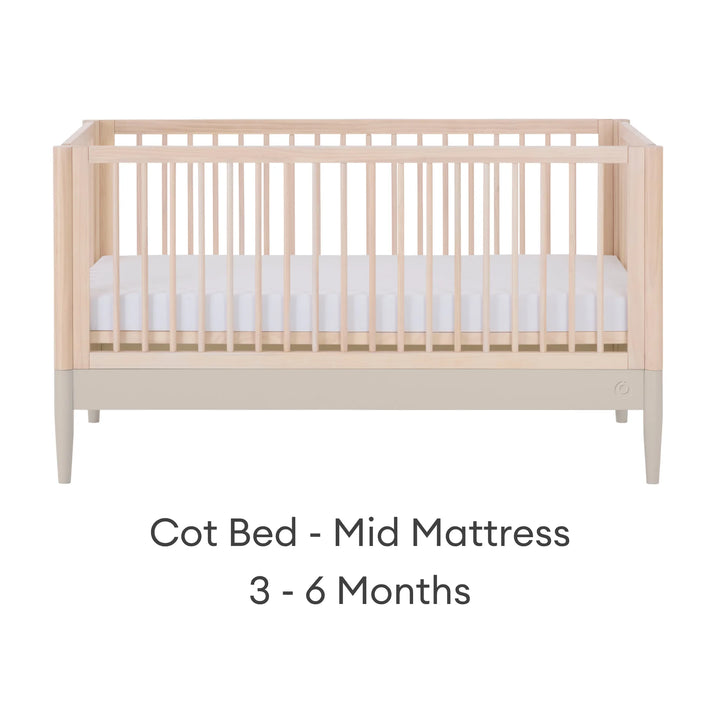 Gaia Baby Eos convertible cot bed in natural wood and cashmere finish with mid-height mattress setting for babies 3–6 months