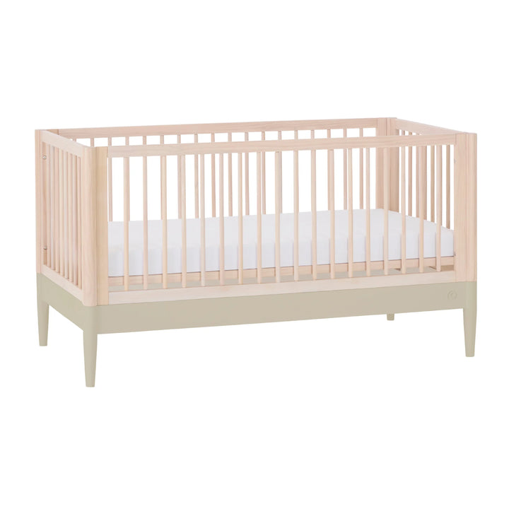Gaia Baby Eos convertible cot in natural desert sage finish, solid wood baby crib with two-tone design on a white background