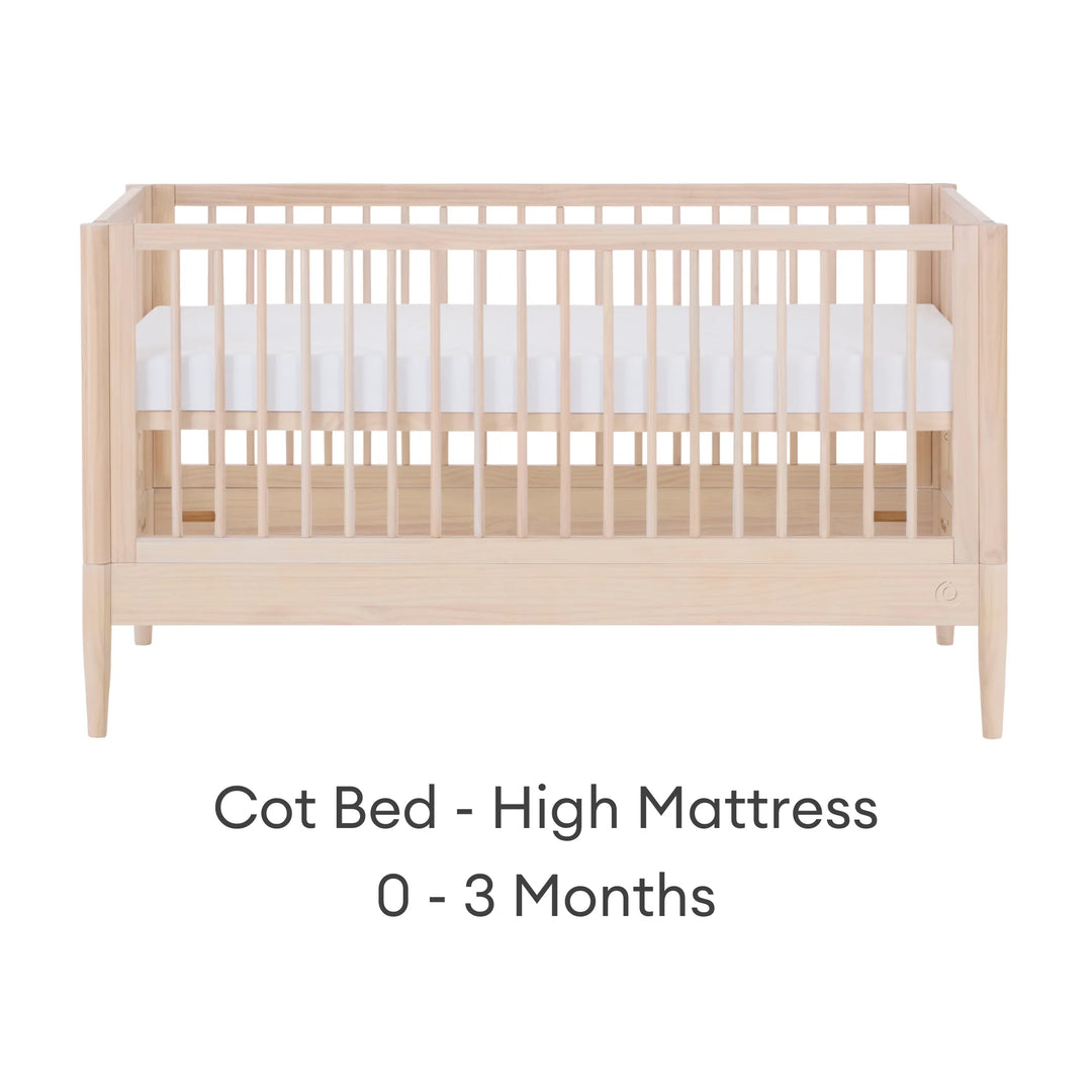 Gaia Baby Eos convertible cot in all-natural wood finish with mattress in high newborn position for 0–3 months on a white background.